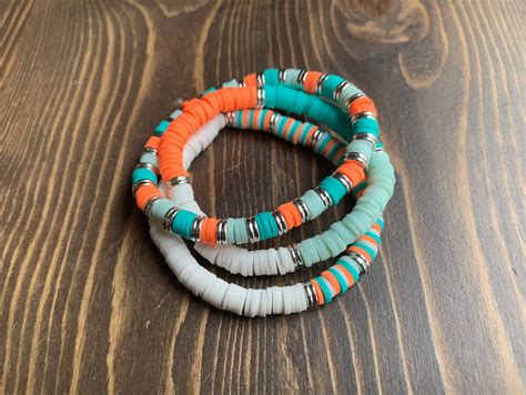 Loop each tail through one more time, and then pull. . Clay bead ideas